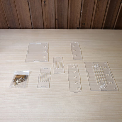 DIY assembly kit featuring precision-cut transparent acrylic panels.#8075