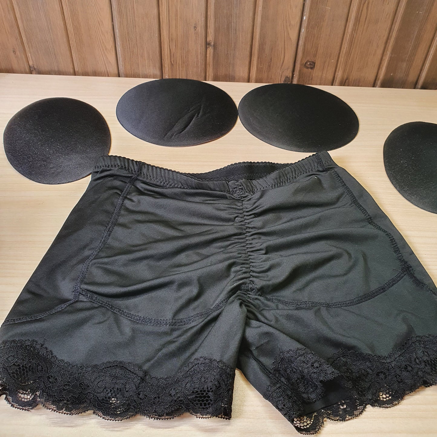 Black AfruliA hip-enhancing shaper features lace trim and includes removable pads for added volume.#8219