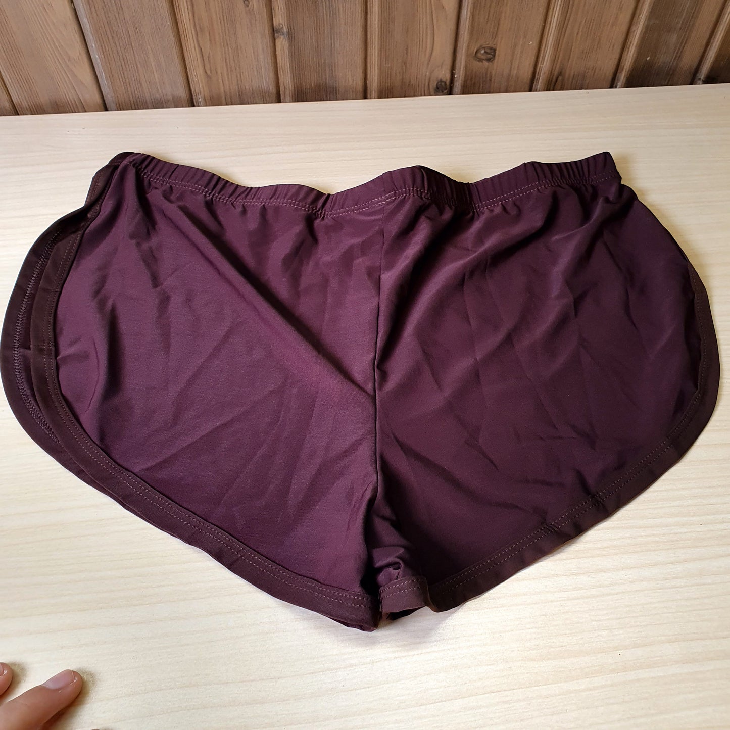 Deep plum active shorts feature a lightweight, stretchy fabric designed for movement.#8332