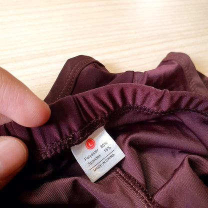 Deep plum active shorts feature a lightweight, stretchy fabric designed for movement.#8332