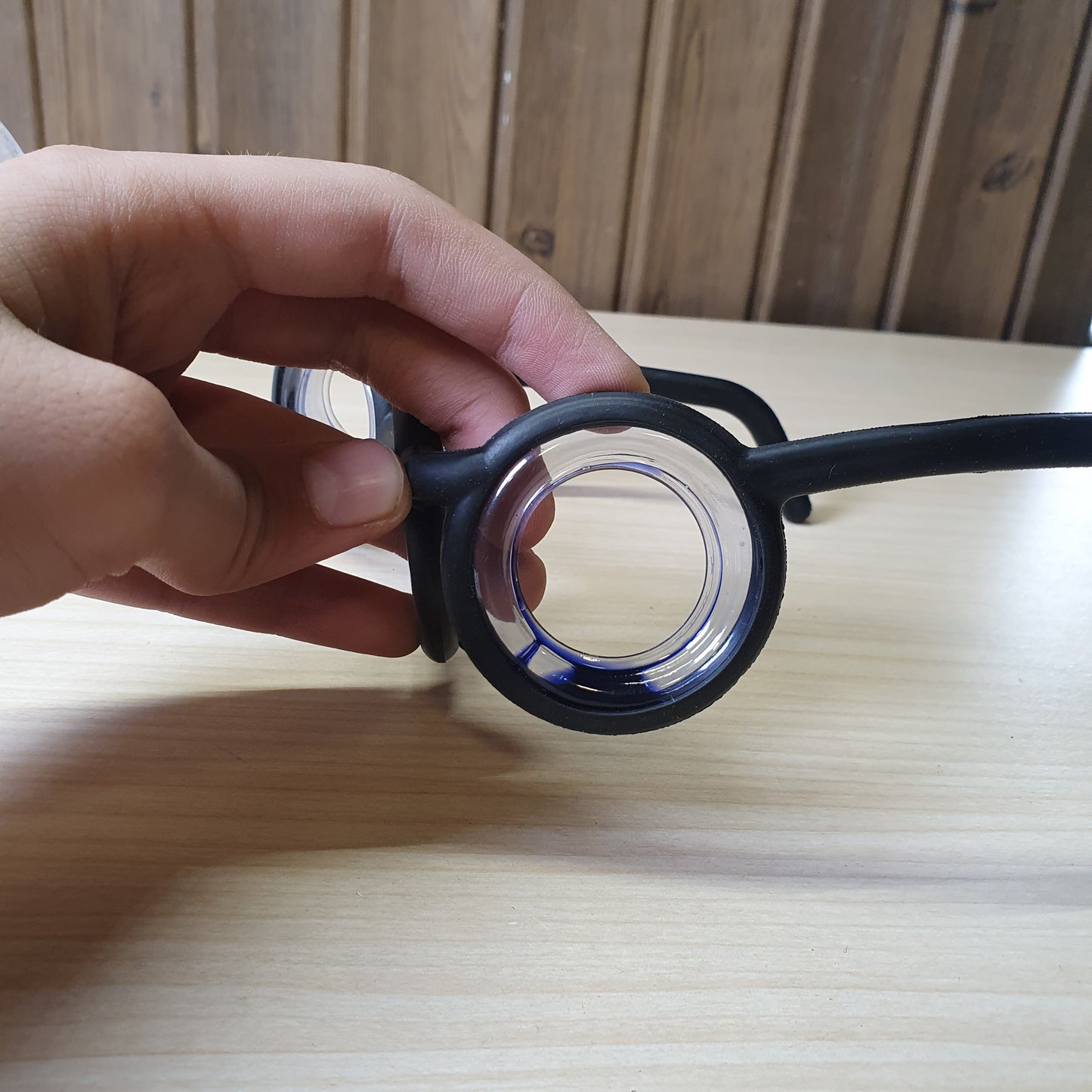 Motion sickness glasses feature a unique lensless frame design with liquid-filled rings that create an artificial horizon to reduce nausea. #8581