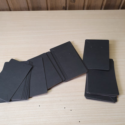 Blank black earring display cards commonly used for jewelry packaging.#8233