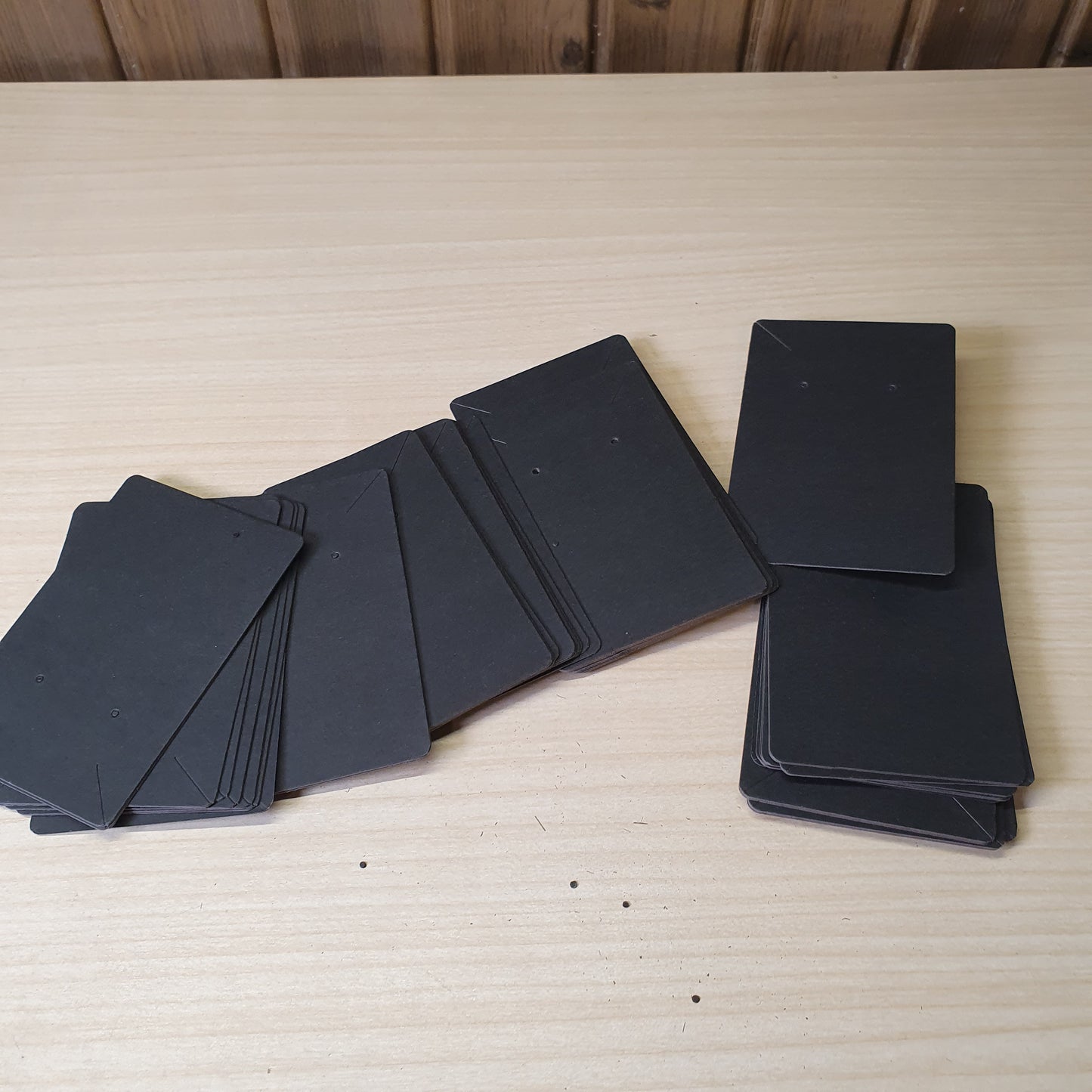 Blank black earring display cards commonly used for jewelry packaging.#8233