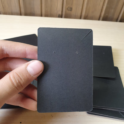 Blank black earring display cards commonly used for jewelry packaging.#8233