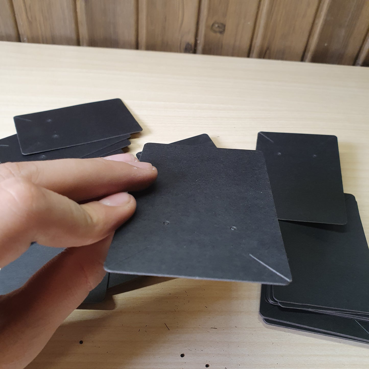 Blank black earring display cards commonly used for jewelry packaging.#8233