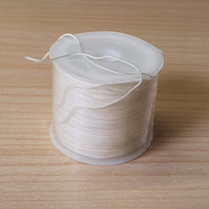 Spool of 0.8mm to 1mm white nylon cord,#8131