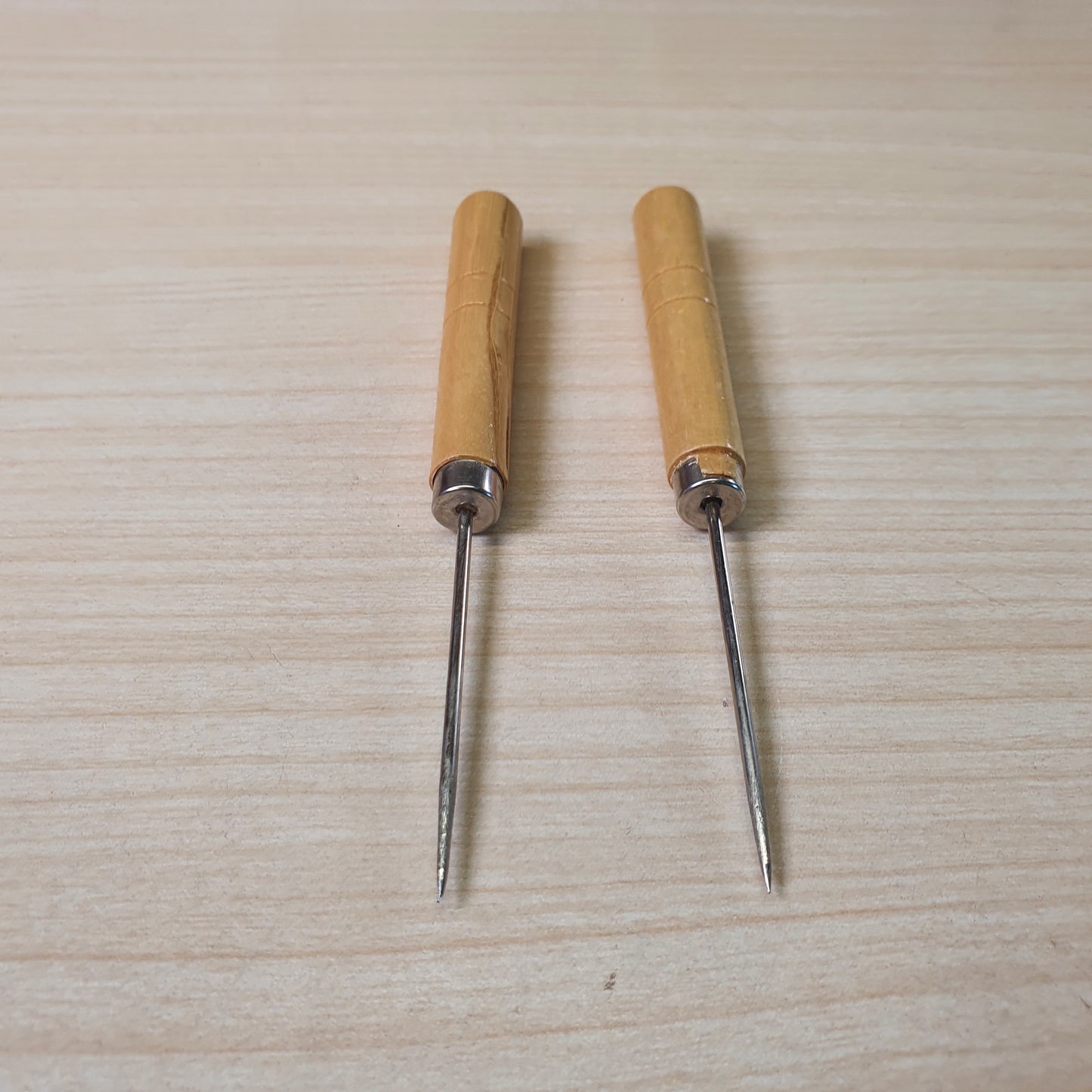 Leatherworking awls, commonly used for punching holes in leather or heavy fabrics for stitching. #9142