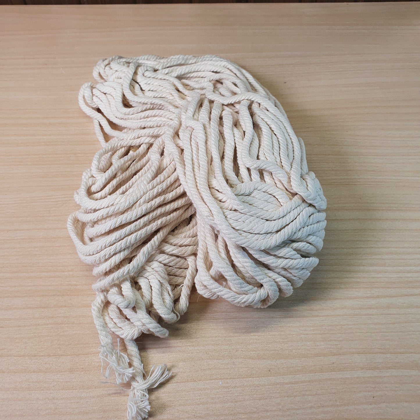 Heavy-duty, off-white cotton rope often used for macrame and crafts. #9298