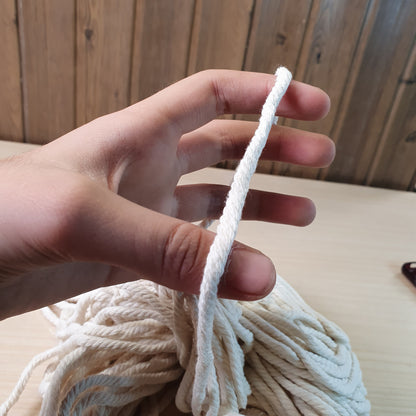 Heavy-duty, off-white cotton rope often used for macrame and crafts. #9298