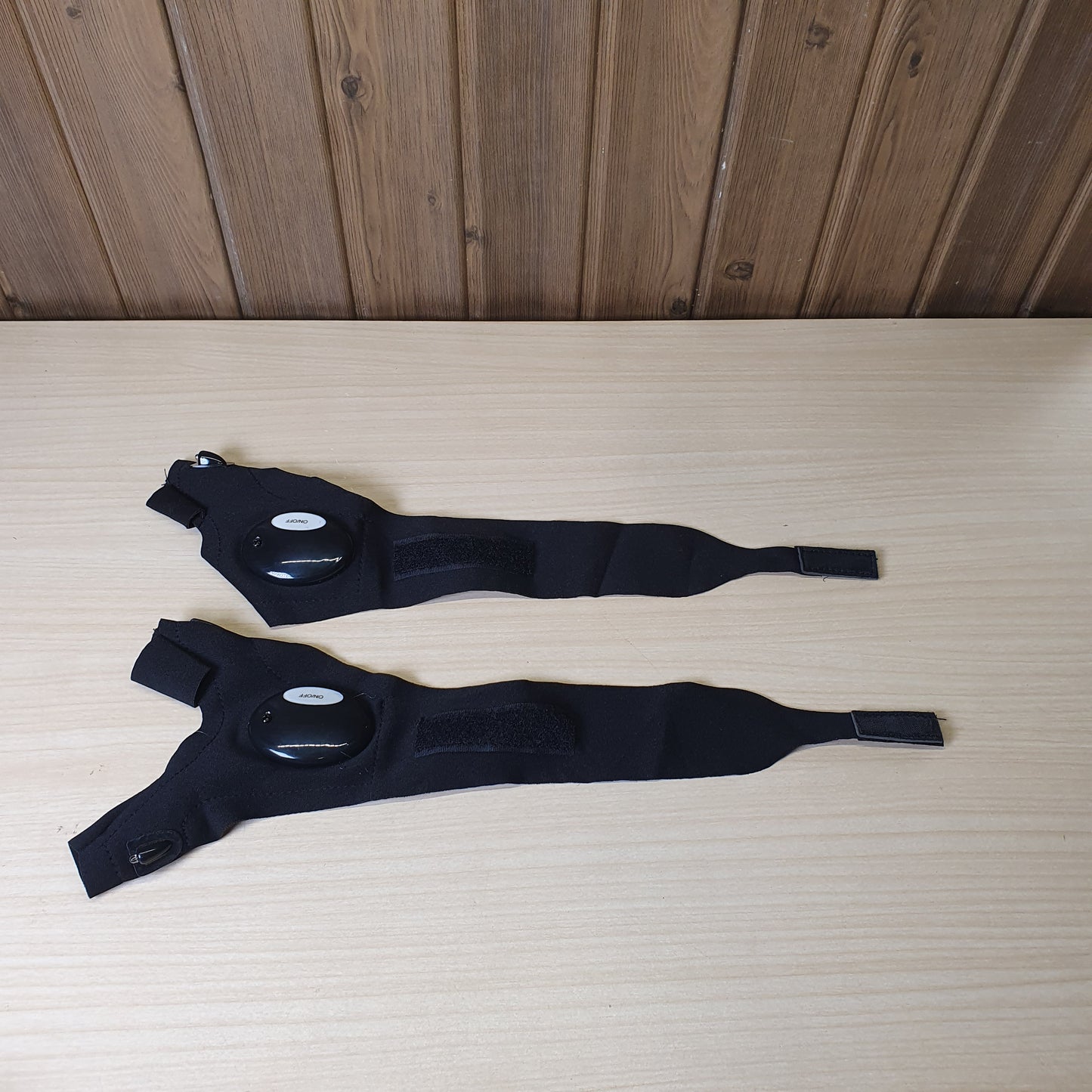 Fingerless gloves feature built-in LED lights for hands-free illumination during activities like fishing or repairs. #9145