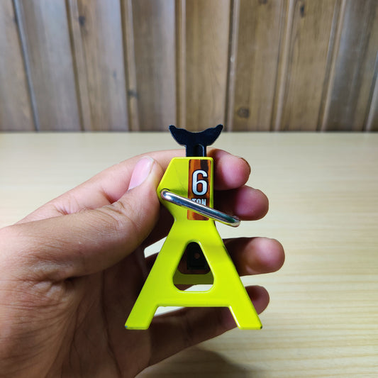 Miniature yellow metal jack stand designed as a decorative accessory for 1/10 scale RC rock crawler cars#2305