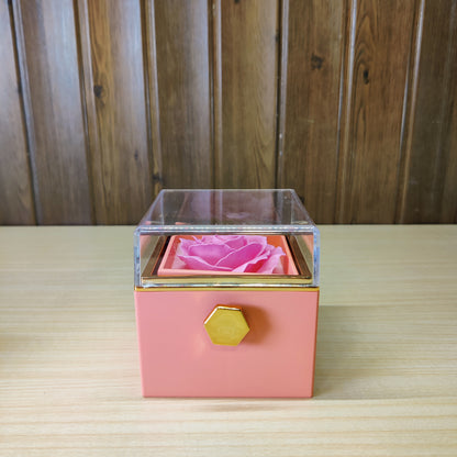 pink rotating eternal rose jewelry gift box with a preserved flower under an acrylic lid #2149
