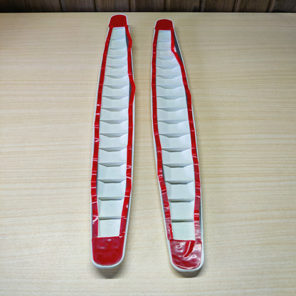 White, rubber car bumper or door edge protection strips designed to prevent scratches and minor collisions.# 2529