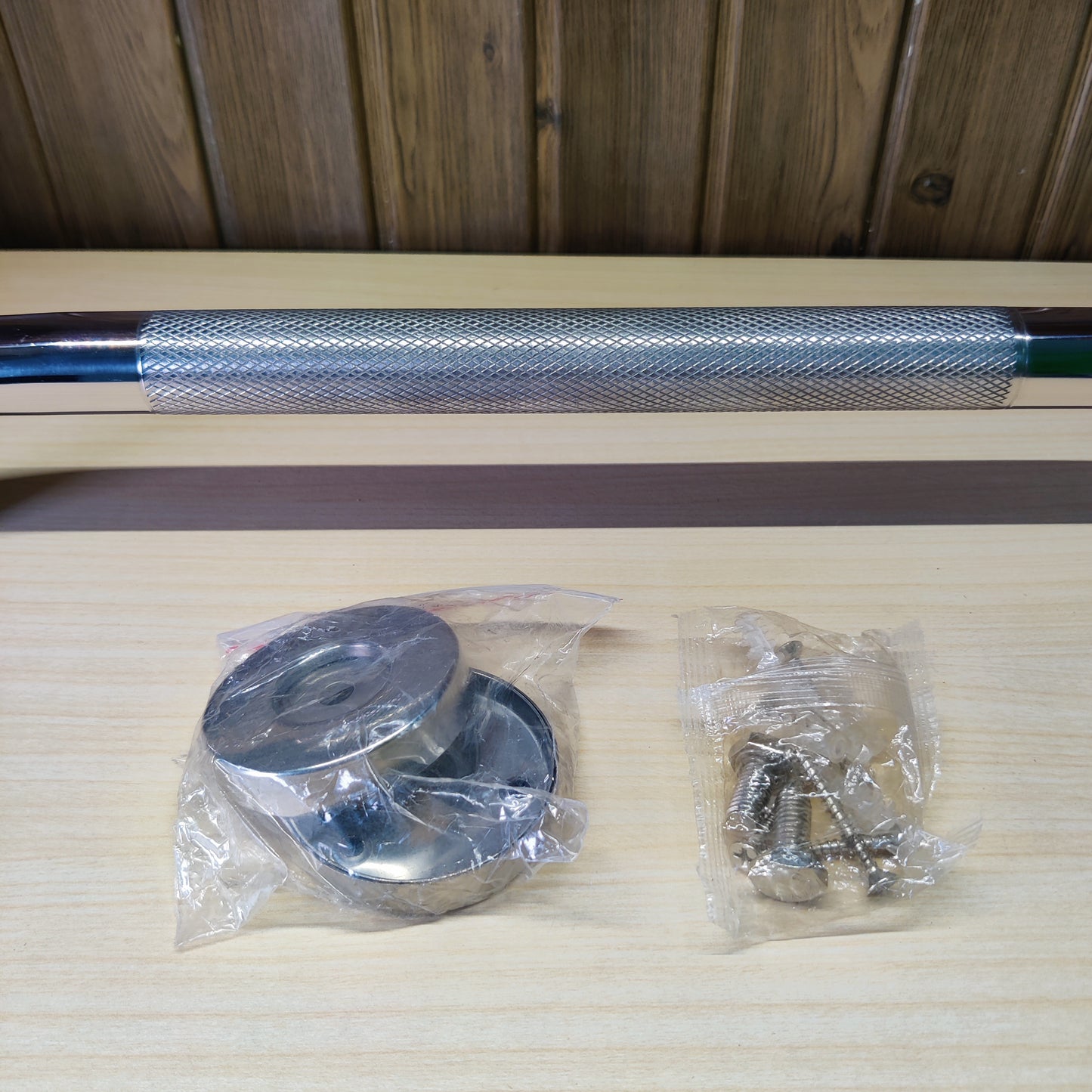 Cabinet pull handle featuring a polished chrome and knurled steel design.#2590
