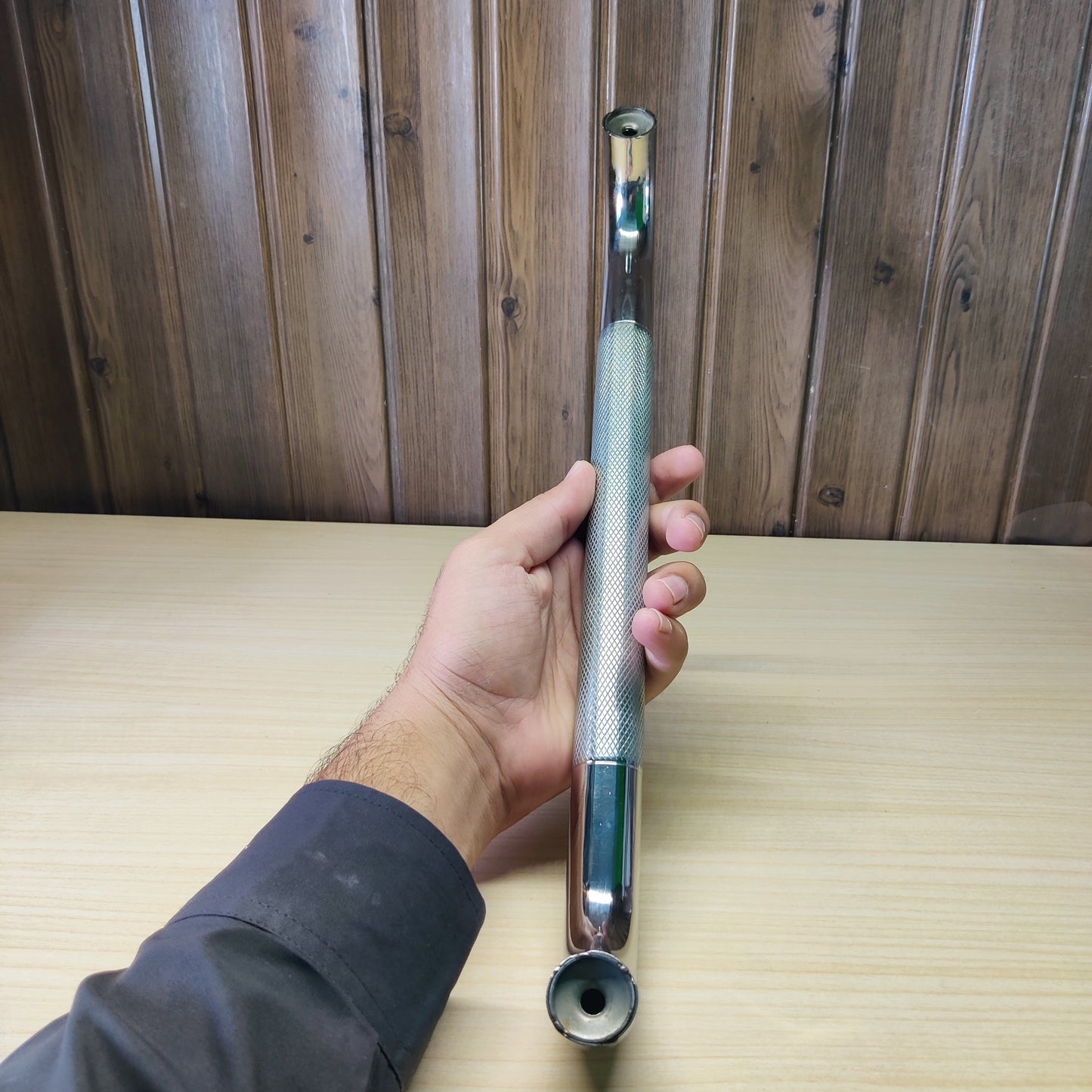 Cabinet pull handle featuring a polished chrome and knurled steel design.#2590