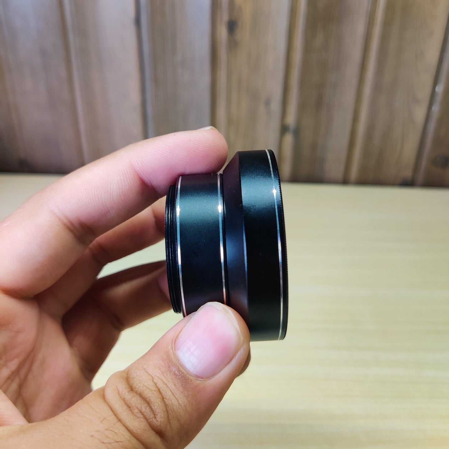 0.6x wide-angle phone camera lens with a macro feature, likely from a brand like Apexel or similar.#2541
