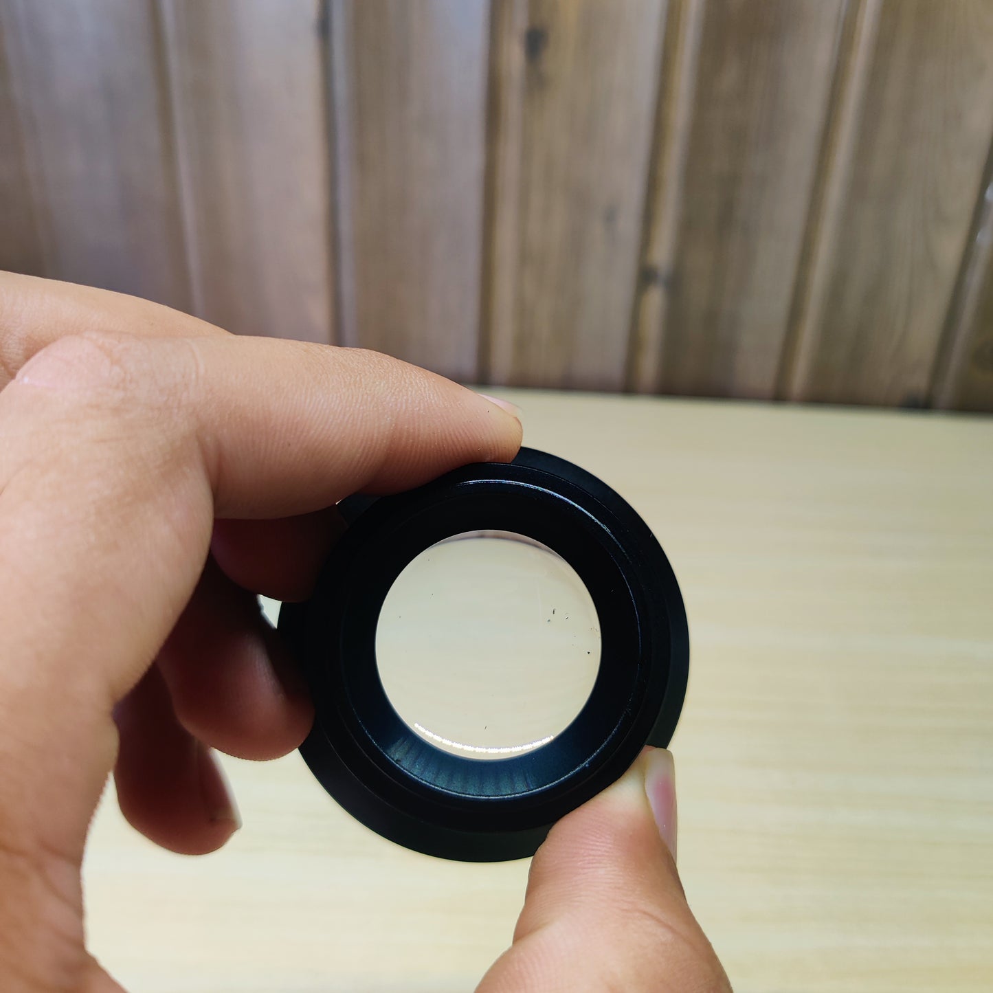 0.6x wide-angle phone camera lens with a macro feature, likely from a brand like Apexel or similar.#2541