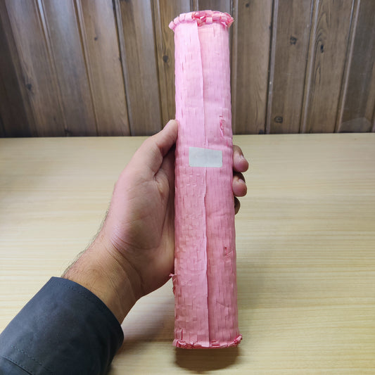 Roll of pink honeycomb packaging paper used for protective cushioning.#2609