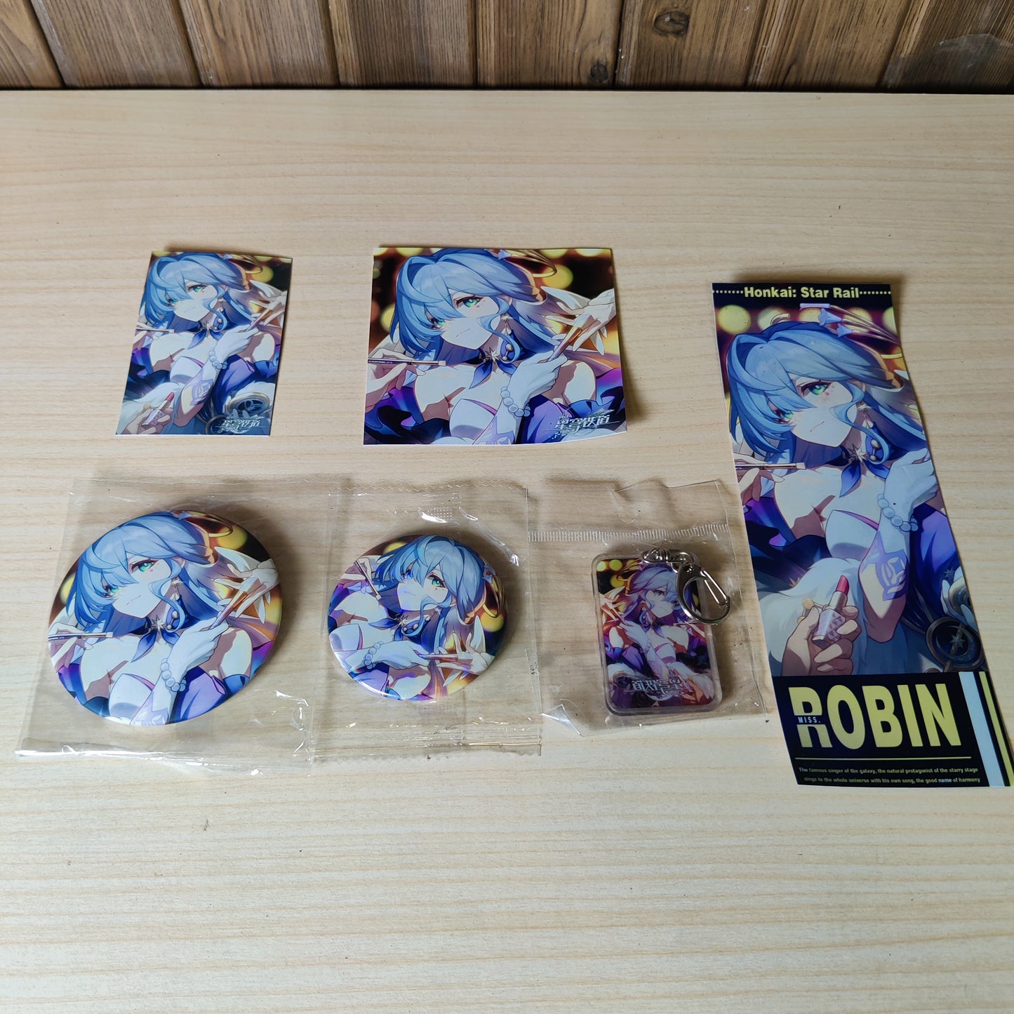 Honkai: Star Rail character merchandise featuring Robin. keychain and badges #3130