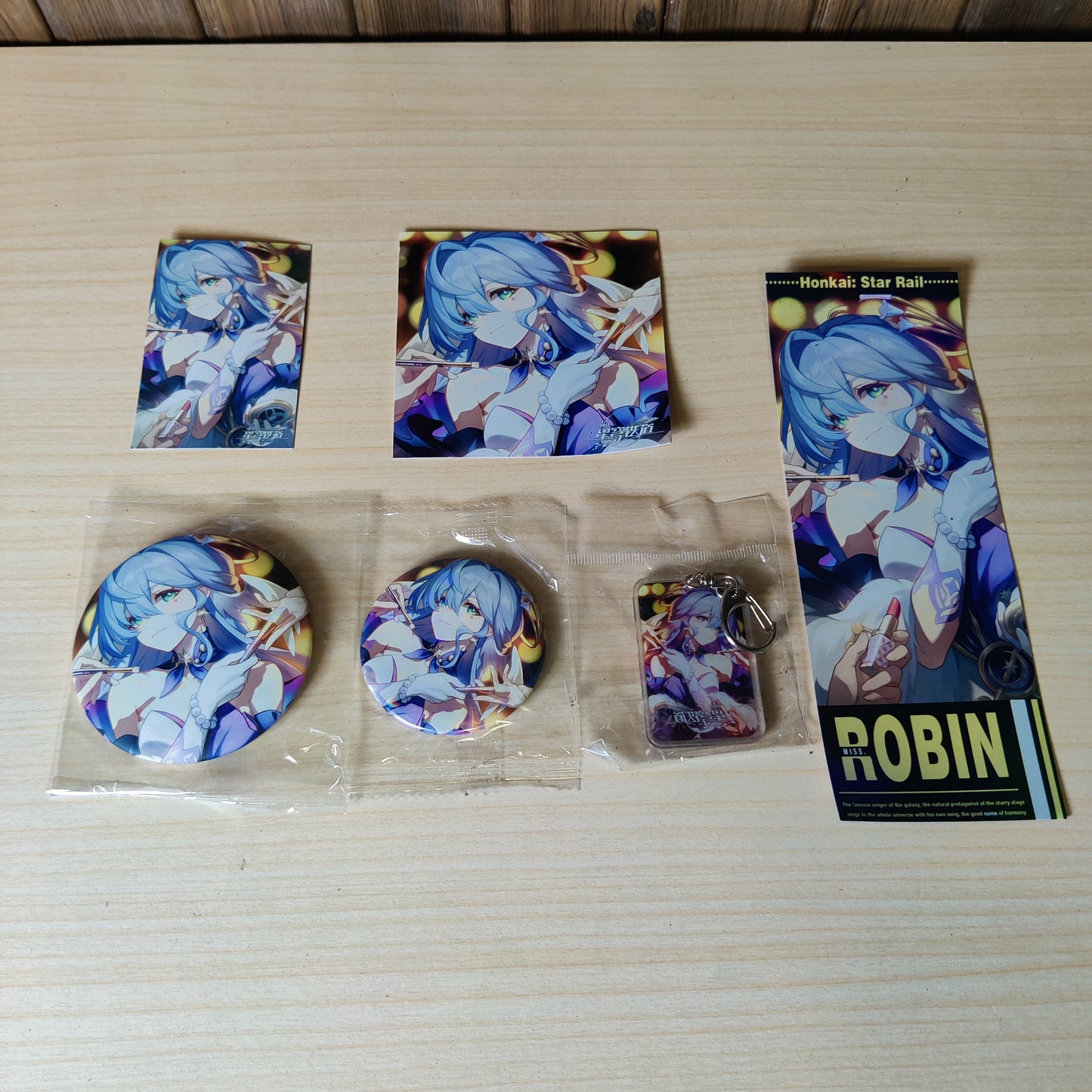 Honkai: Star Rail character merchandise featuring Robin. keychain and badges #3130
